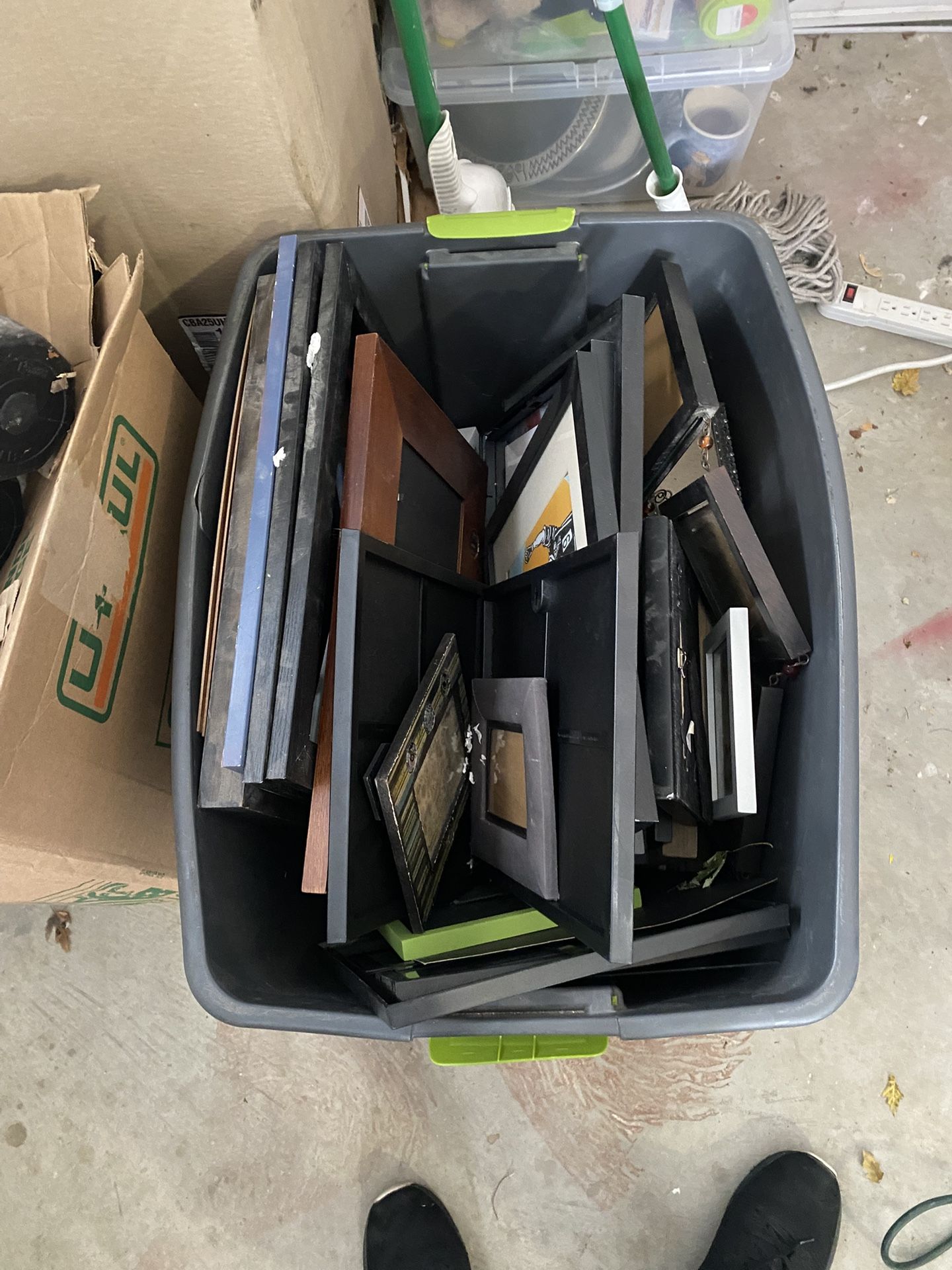 A bin of picture frames different shapes and sizes. Art project materials