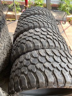 33x12.50R24"set of four a tire has patch shown in the photos