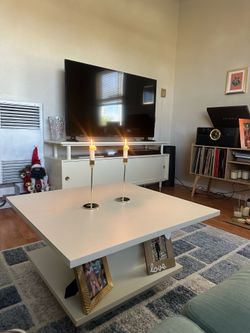 Square coffee table with hidden storage
