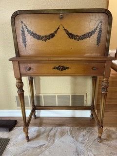 Antique fall-front secretary desk on a frame