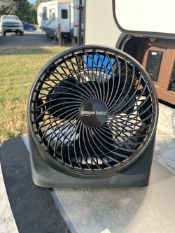 Amazon Basics Air Circulator Desk Fan for Bedroom, Home, and Office, with 90-Degree Tilt Head.