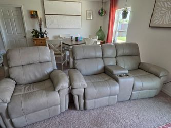Genuine Grey leather couch, love seat, and recliner.