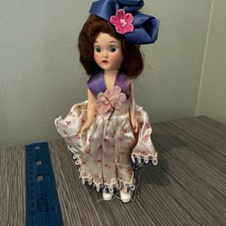 Vintage Floral Doll with Blue Hat - Classic Collector’s Figure with Character