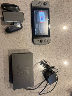 Nintendo switch 1 with grey controller, Tetris 99, tv dock and charger.