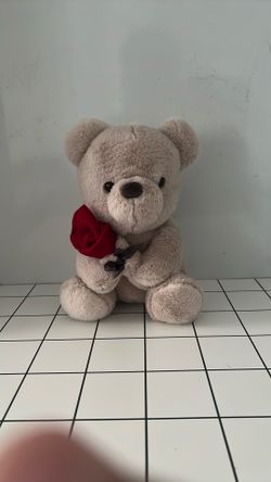 Cute Teddy Bear With A Rose