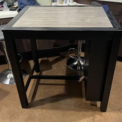 Black’s high-top dining table