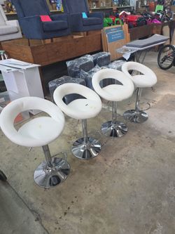 Vinyl  leather round- back adjustable bar stool featuring a polished chrome hydraulic pedestal base - set of 4