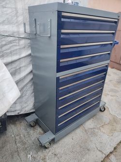 Tool box heavy duty. It's a cabinet converted in to a tool box. 53"H 34"D 18"D. 10 drawers base is removable bottom of cabinet has light surface rust.