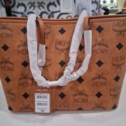 MCM. Modern creation Munich.
Cognac, go to mcclean canvas leather tote bag
