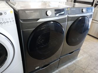 Samsung gray front load washer and dryer set on pedestals - Free delivery