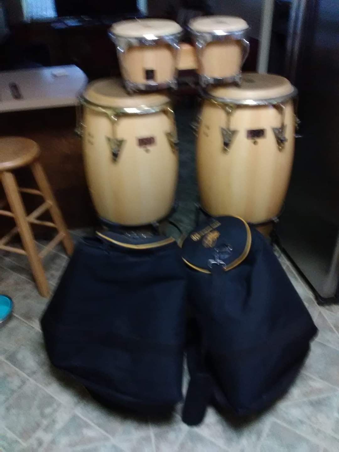 Two Latin percussion congas with bongos carrying case for the conga and Stan as well