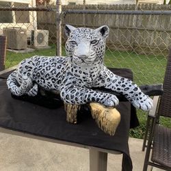 Snow Leopard On The Log Statue