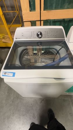 2 Wash machines One GE electric other Whirlpool older model washer and Dryer