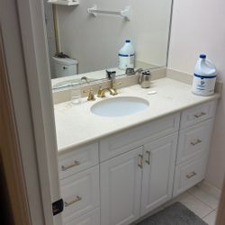Bathroom; 60inch Vanity, Mirror, Kohler Toilet, Delta Diverter, 60inch Shower Doors