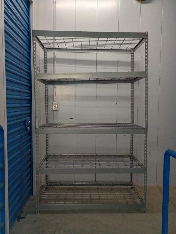 Metal Wire Rack Solid Metal In Good Conditions. With Adjustable Shelves