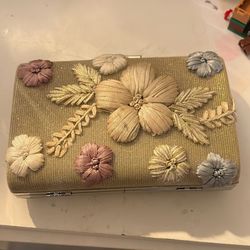 2 intricate gold mini purses