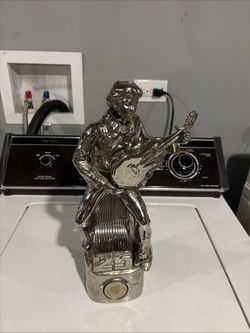 Elvis silver statue head needs work