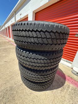 LT275/65/R20 Bridgestone dueler all-terrain 10 ply load range E Chevy Gmc Ford Rims