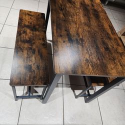 Small kitchen table with benches.