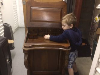 Antique stationary, (postal) desk with hidden compartments and drawers on inside under front cover and along the sides.