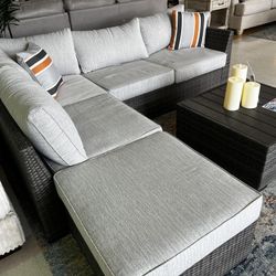 Cherry Point Gray Outdoor/Patio 2 Piece Sectional, Ottoman and Coffee Table Set