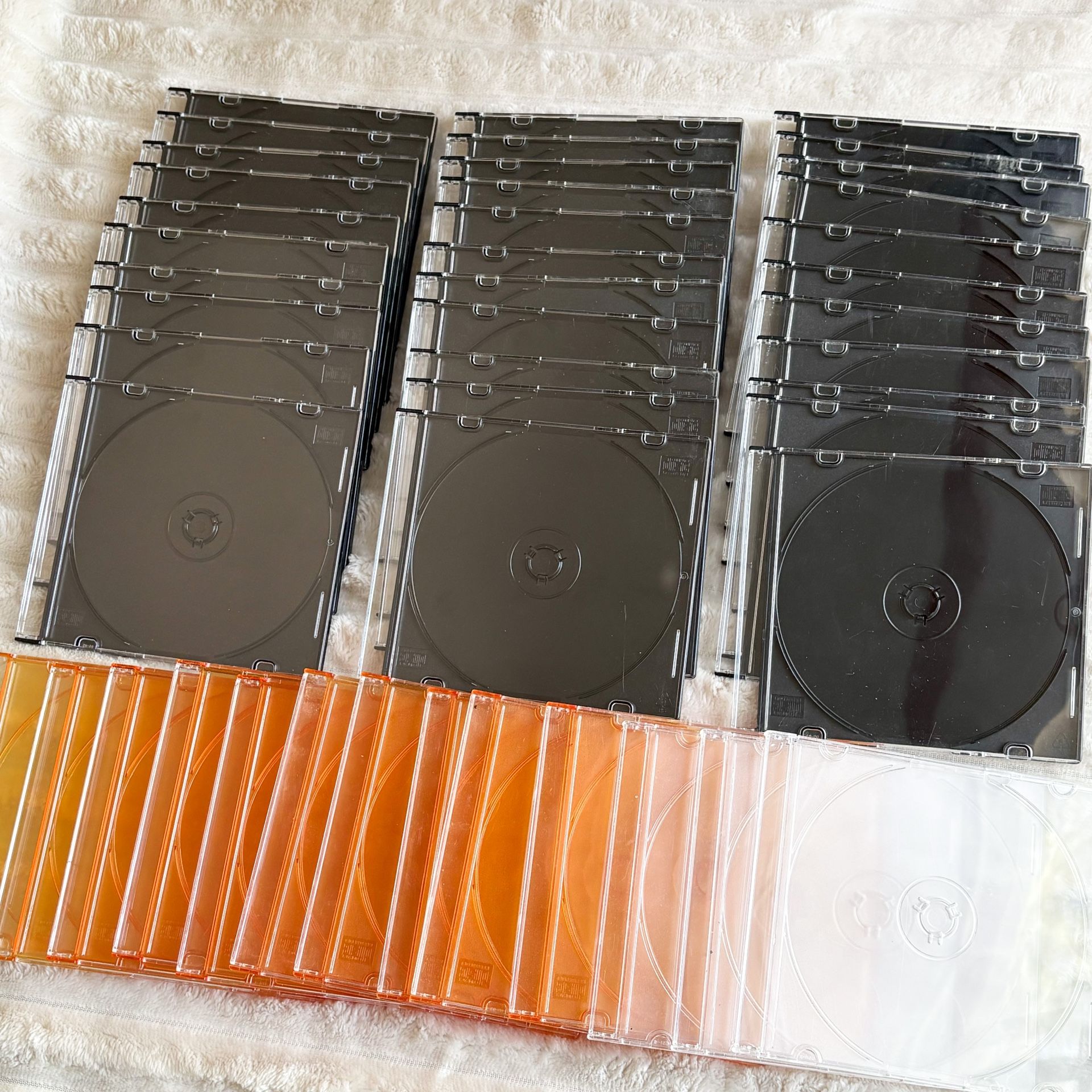 44 CD / DVD Slim Jewel Case Holders In Black, Clear & Orange