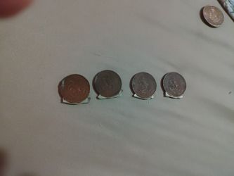 Antique Mexican pesos.