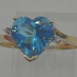 10KT YELLOW GOLD RING SIZE 8.75 3.4 GRAMS HEART BLUE STONE 2 SMALL DIAMONDS.877909-1. 