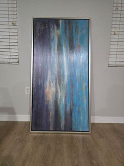 Beautiful oversized abstract wall art featuring shades of blue, navy, white, gold, and orange with a modern metallic-style frame. Great statement piec