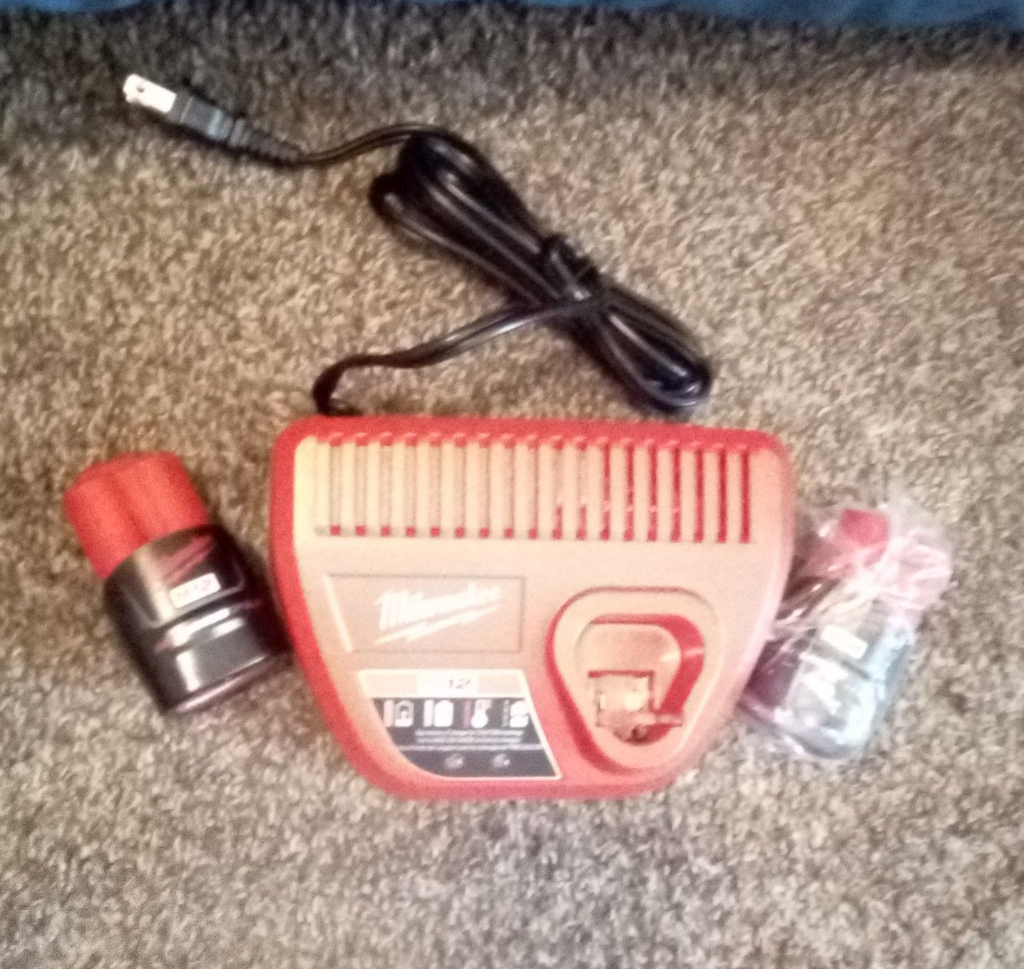 Milwaukee brand new charger w/2 red lithium CP2.0 batteries