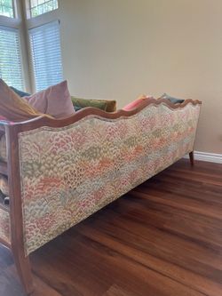 Used Wood framed unique sofa with pillows