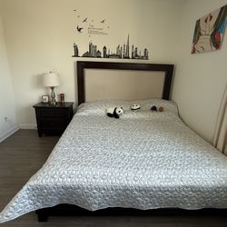 Bed, mattress, nightstand, and cabinet.