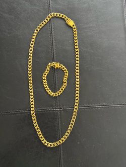 chain and bracelet. Long 30” . Stanley steel. Used in good condition