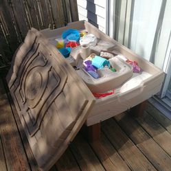 Sand box, perfect for kids,hours and hours of play. It Has A Umbrella Hole In The Middle. Very Good Quality. My Kids Outgrew It.