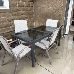 Outdoor glass table and chairs