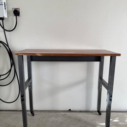 tall adjusting steel and wood work table (48 w, 24 deep) 