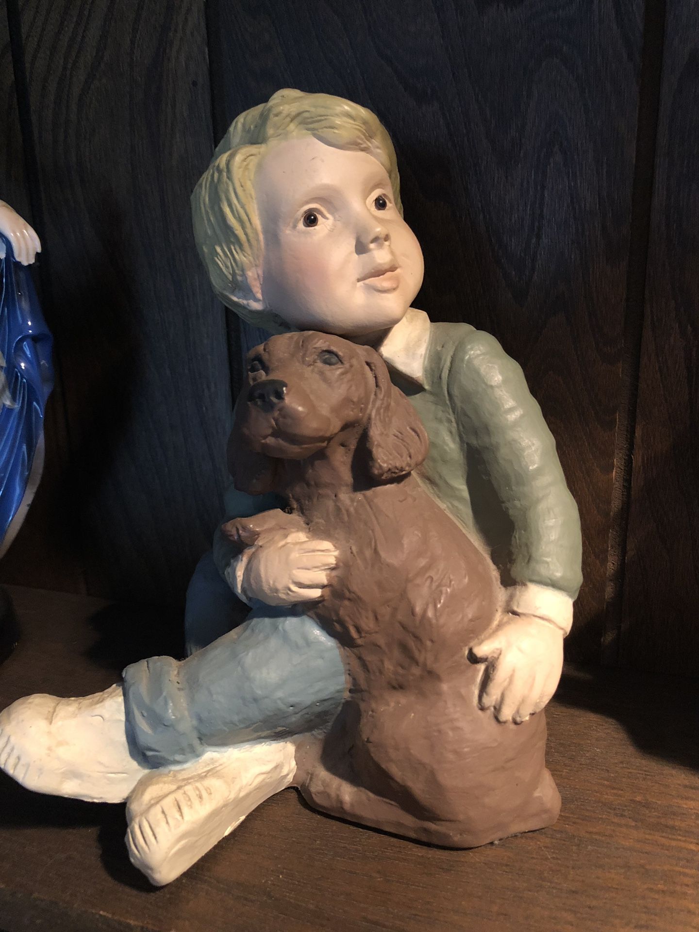 Boy with dog statue figurine