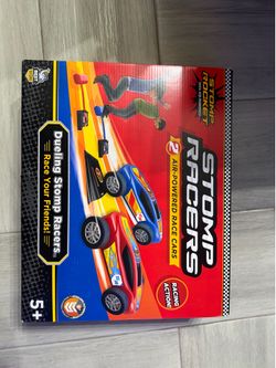 New Stomp Rocket Dueling Stomp Racers set includes two air-powered race cars in red and blue. This STEM-authenticated toy has two launchers, one ramp,