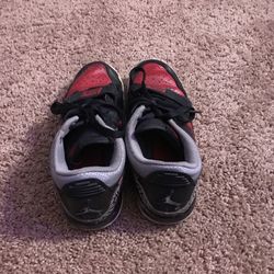Red and black air jordans
