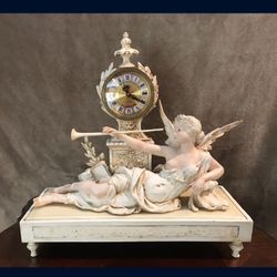 Clock With Angle Statue