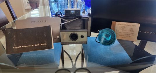 Vintage 1965 Polaroid 103 Camera Set w/ Camera, Flash, Case, Book, and Strap.
Your chance to own a piece of history. Complete Set in good condition.