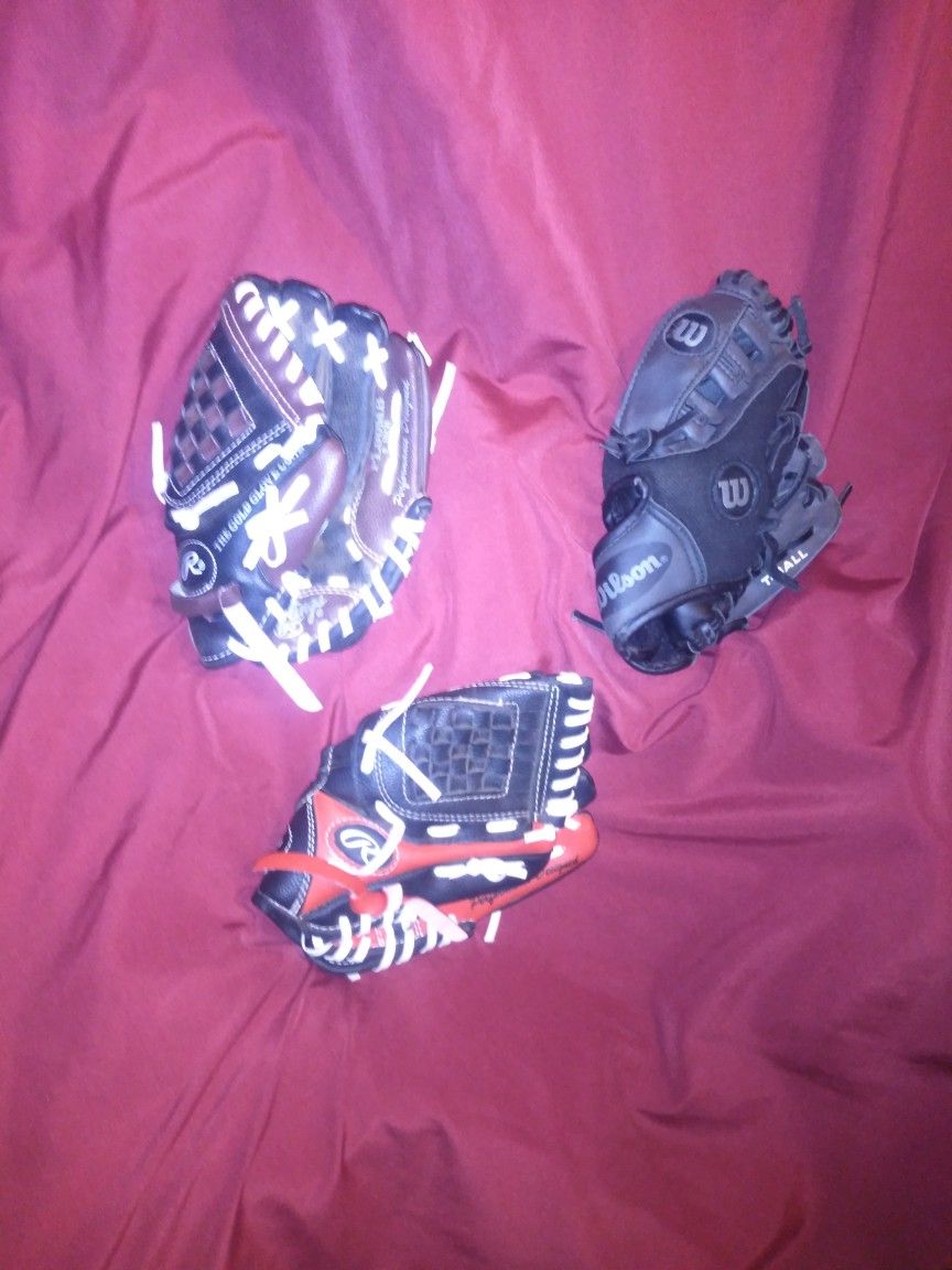 (3)...9" T-ball Gloves Including (2) "Rawlings" And (1) "Wilson"