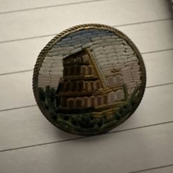 antique Italian micro-mosaic brooch, likely a Victorian-era "Grand Tour" souvenir depicting the Colosseum in Rome. 