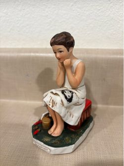 Little lady reading a magazine figurine