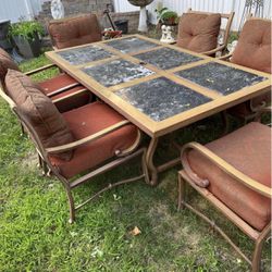 Very nice outdoor patio set six chairs with matching cushions and a hole in the center for an umbrel