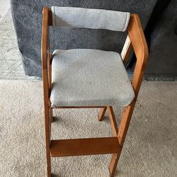 Wooden high chair with cushion