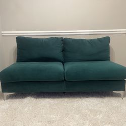 VELVET GREEN COUCH AND WHITE RUG 