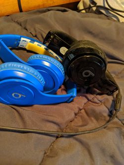2 par of beats headphones