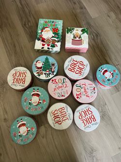 12 holiday boxes + 3 spools of ribbon