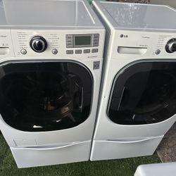 LG front load washer and electric dryer on pedestals!